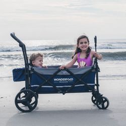 WONDERFOLD X2 Push & Pull Stroller Wagon (2 Seater) - Collapsible Wagon Stroller with 5-Point Seatbelt Harnesses, Push & Pull Handles & Removable Sun