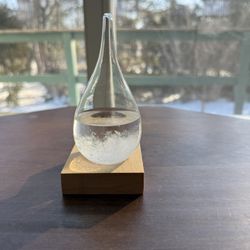 Storm glass weather predictor and wooden base