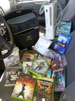 Two Xbox 360s and a bunch of different games