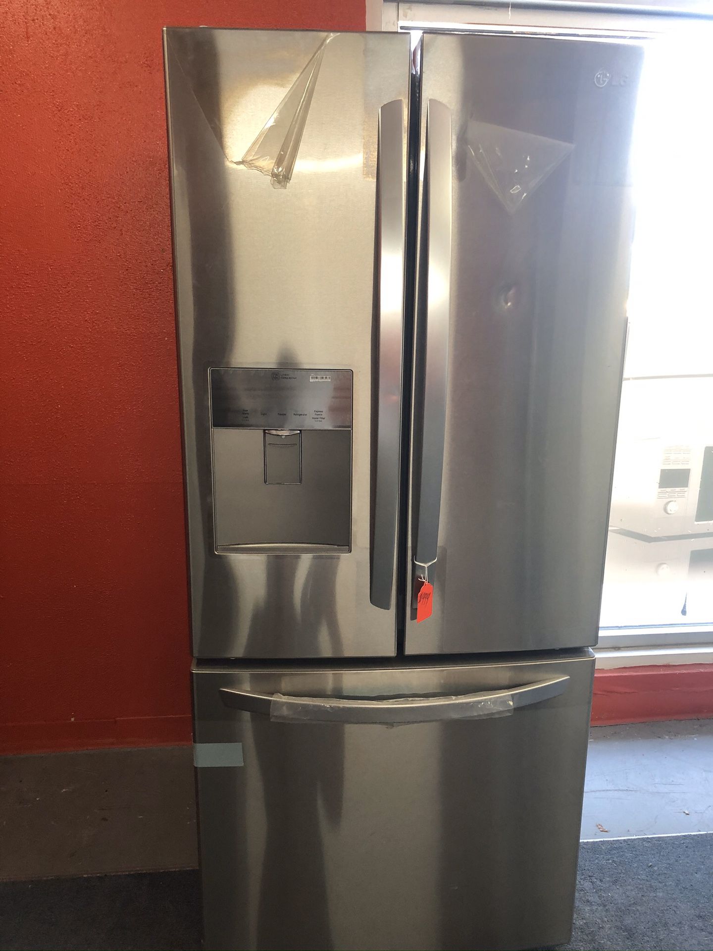 New scratch and dent LG 21 cu ft stainless steel French door fridge. 1 year warranty