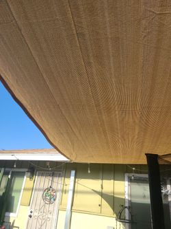 BRAND NEW GREY TARP..ABOUT 12FT BY 10FT... CHECK OUT MY PAGE FOR MORE..PICK UP IN VICTORVILLE...SE HABLA ESPANOL..