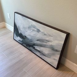 Target art with dark wood frame