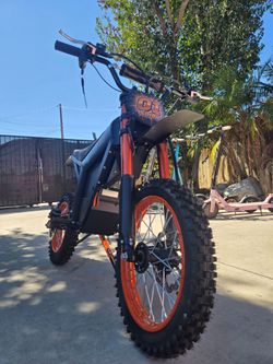 Metallic orange and black Electric Dirt Bike, 37mph