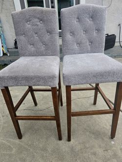 3 gray bar stools