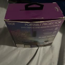 Purple portable projector with tripod and remote control #Projector #HomeTheater