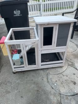 A great hutch for rabbits or other animals; it features two levels, two trays, and a ramp, and includes food accessories. It measures 37 inches long,
