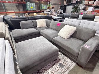 Grey fabric sectional with ottoman from Costco
