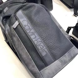 Brand new with tag Calvin Klein men's black/gray man made durable leather  sling bag  backpack Crossbody bag