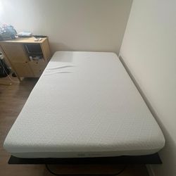 Full Size mattress with its frame and a fitted sheet