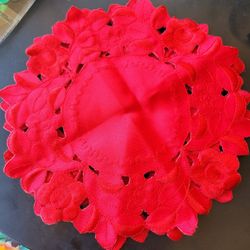 2 red machine made doilies 