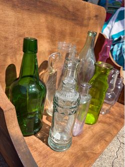 26 bottles used as vases for wedding decor