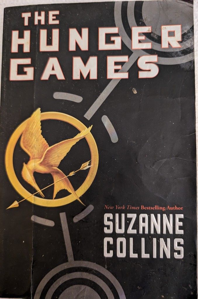 The Hunger Games By Suzanne Collins A Scholastic Paperback Book 374 Pages, The Top Half Of A Blank Page In Rear Is Torn Off.
Winning means Fame And F