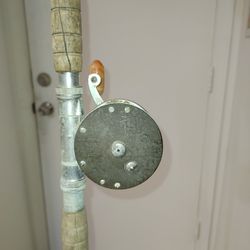 Three Vintage Fishing Poles