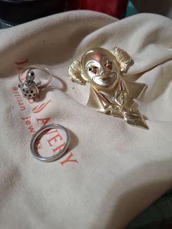 Gold  patad  clown  pendantin and real silver rings size 10.     25 each