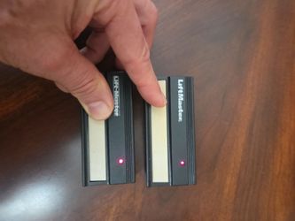Remote garage door openers-Pair