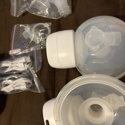 Momcozy S12 Pro wearable breast pump set, including the pump motors, collection cups, and accessories. 