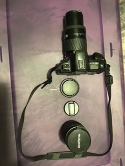 Minolta Maxxum 300si with AF zoom 70-210 lens,promaster lens 28-105mm with caps