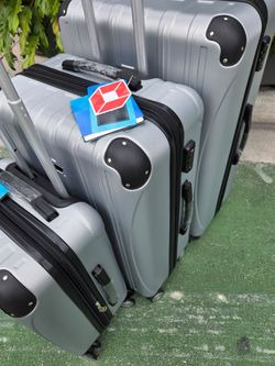Travel Suitcase  3 Pc.set 8Wheels Spinner Hard Shell New With Tags Tsa Lock Extra Lightweight Expandable Waterproof Silver Color