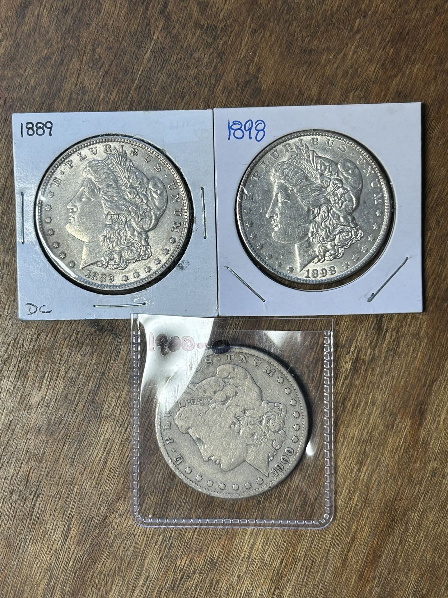 Three Morgan Silver Dollars. Group 26.