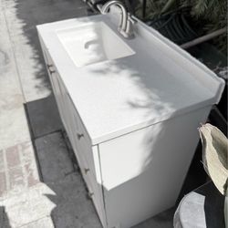 Bathroom sink with cabinet