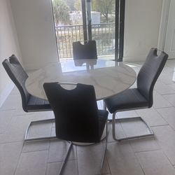 Marble style table with 4 gray chairs