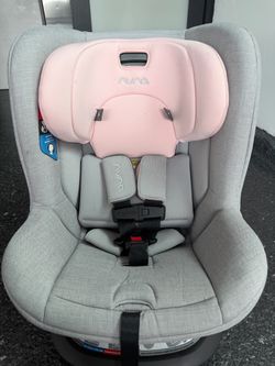 Nuna RAVA Next Convertible Car Seat in the Edgehill Pink