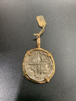 Atocha silver coin pendant in gold bezel