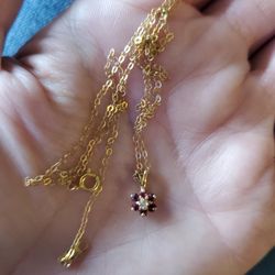 10k Gold Necklace Diamonds And Rubies I Assume.