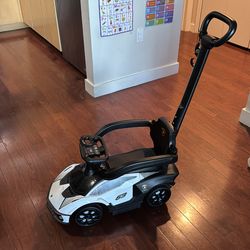Toddler push car. Steers from handle.