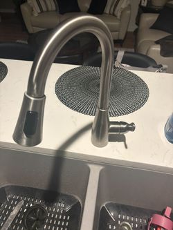Brushed Nickel Hardware And Kitchen Faucet