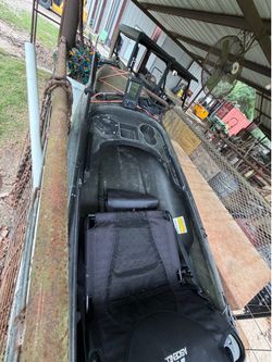 Kayak with 2 rod holders, paddle mount, and Lowrance fish finder.