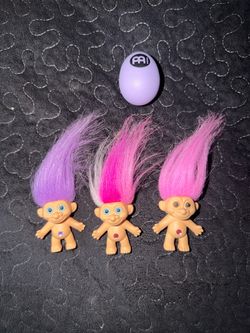 3 toy story-style trolls with certificate