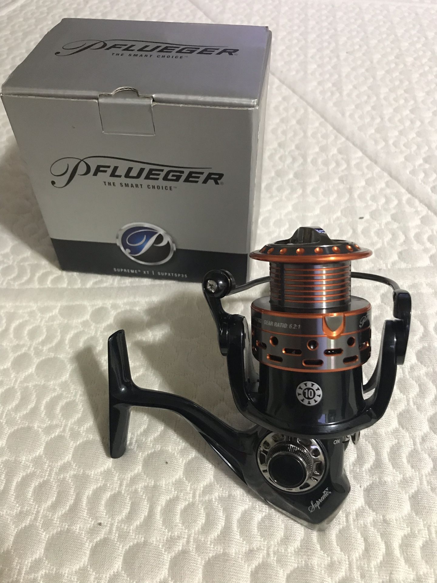 Brand new Pflueger supreme xt fishing reel retails for 150$ with box