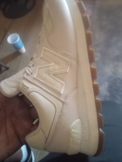 New Balance 574 Core sneakers featuring an "N" logo on the side and an ENCAP midsole
