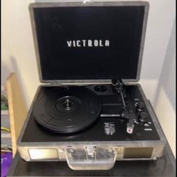 Victrola Vintage 3 Speed Bluetooth Portable Suitcase Record Player with Built-in Speakers.