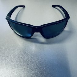 Oakley Gibston Sunglasses (Model OO9 ) with Dark Green Prizm Polarized Lenses ,wrap sporty design, “USA MADE” marking on the temple, and what 