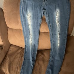 ripped blue skinny denim jeans. 