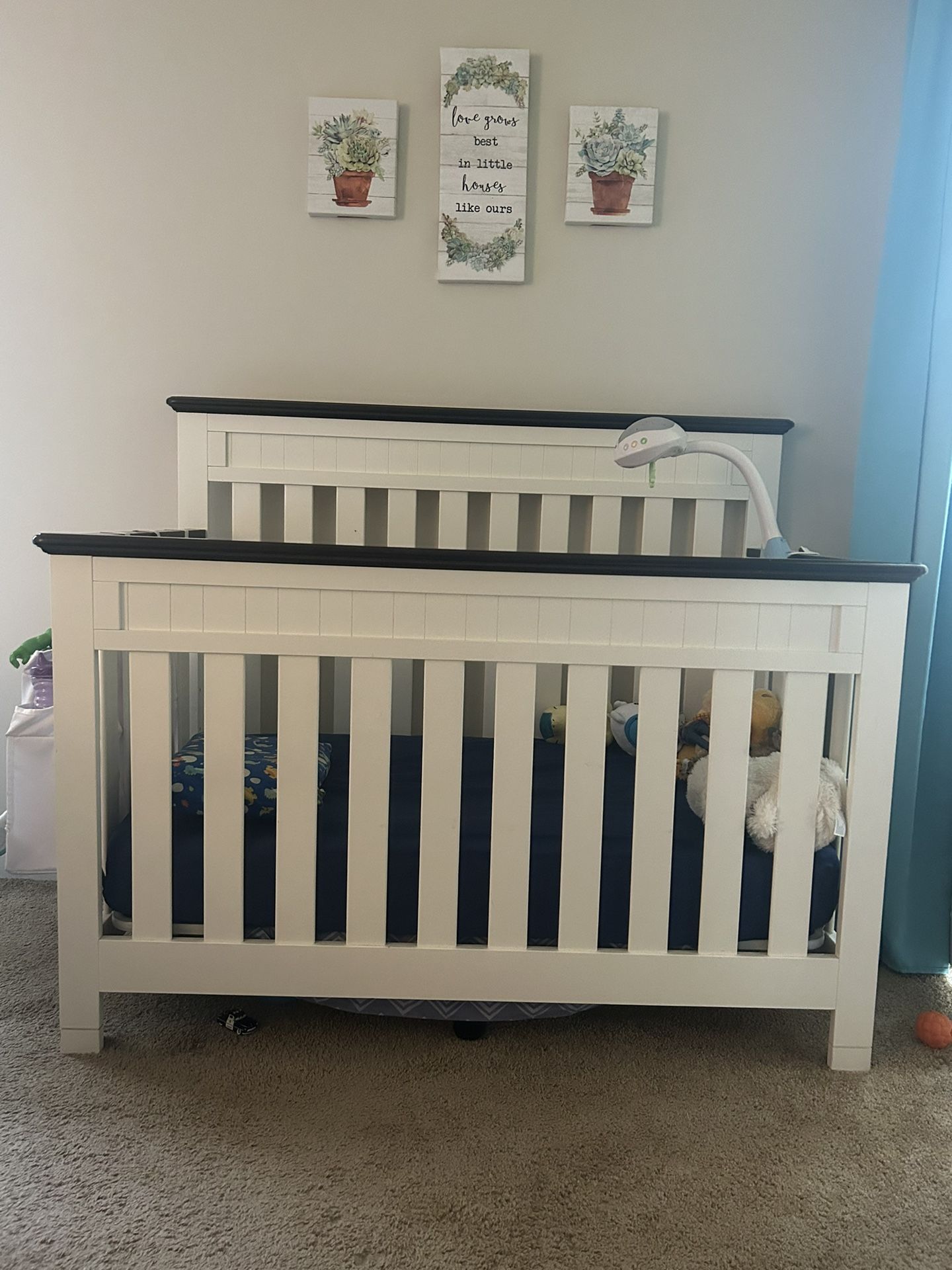 White Wooden Crib With Dark Brown Trim