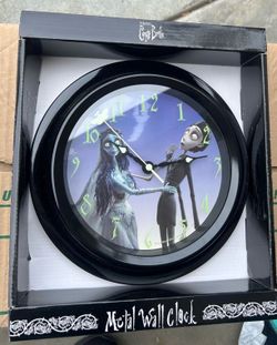 Tim burtons corpse bride metal wall clock. New in package. Measures 9x9. Pick up only. Needs AA batteries.