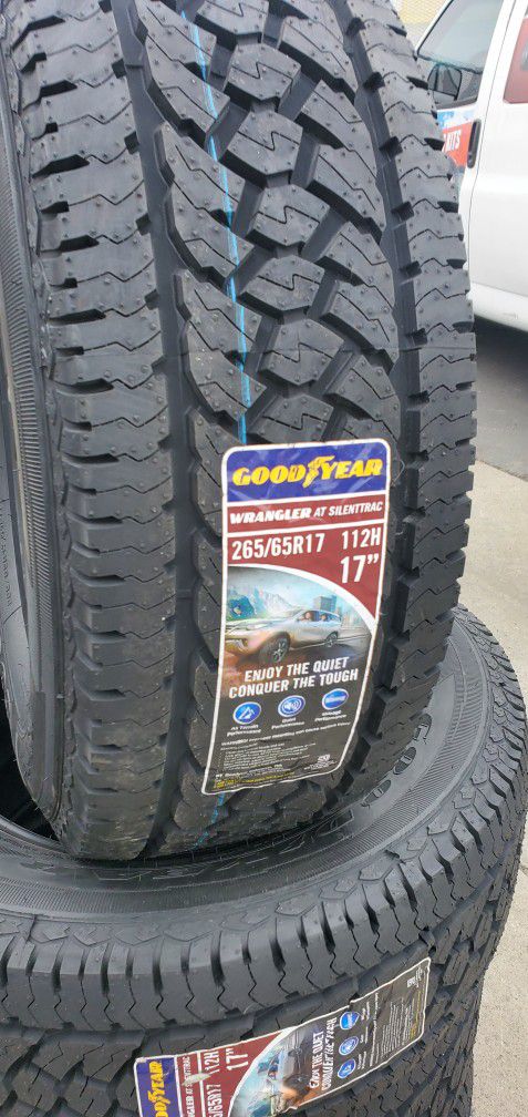 265 65R17 Goodyear WRANGLER AT SILENTRAC  NEW TIRES  $580 SET OF FOUR INSTALL MOUNT AND BALANCE 