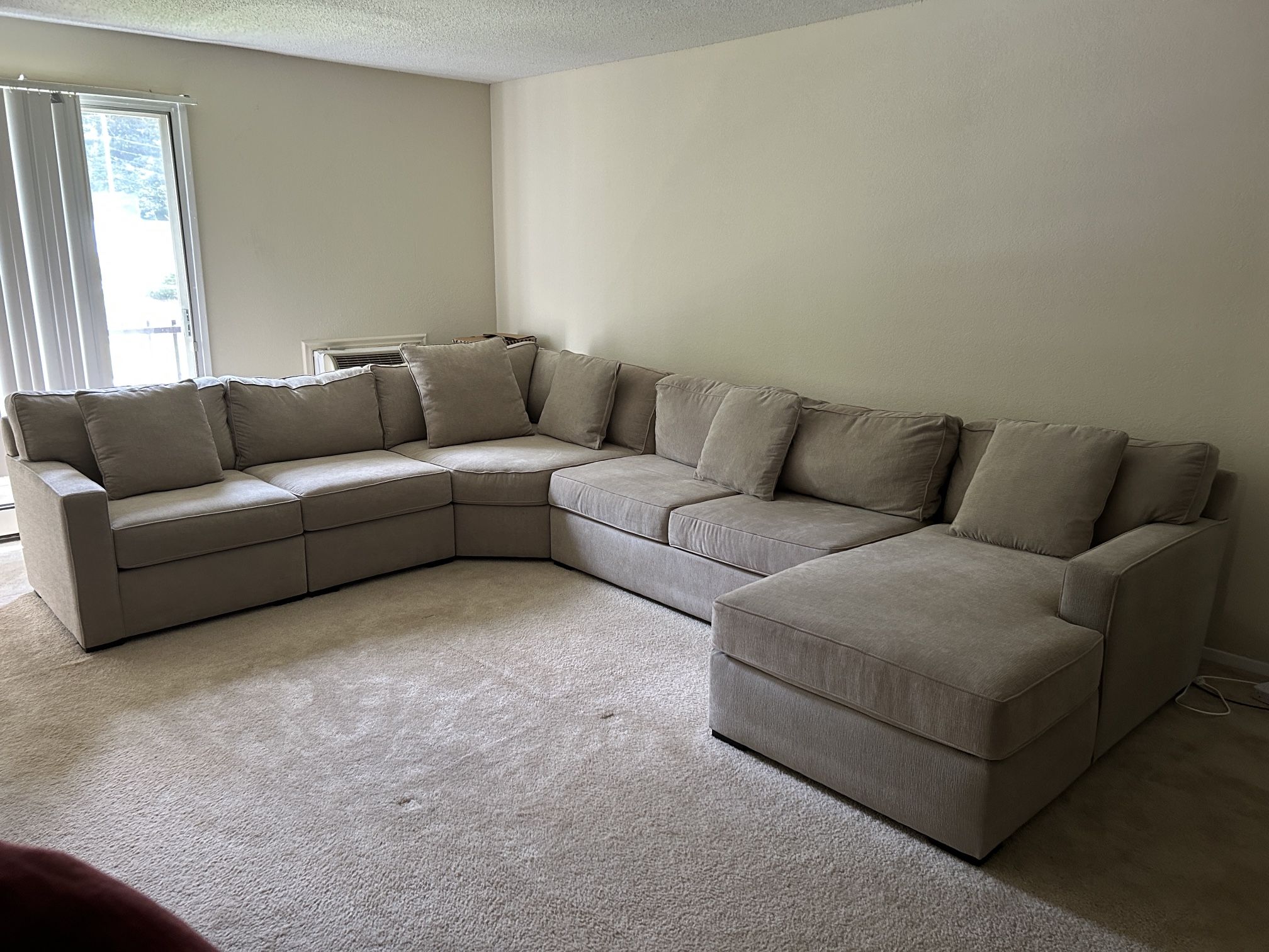 Beige L shaped sofa