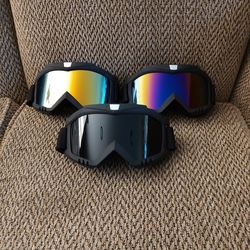 MOTORCYCLE GOGGLES.  BLACK,  BLUE MULTI COLOR AND GOLD MULTI COLOR LENS. ADJUSTABLE STRAP.   $20 EACH.  NEW.  PICKUP ONLY.