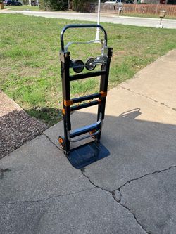 3-in-1 convertible folding steel hand truck with a capacity of up to 600 pounds and orange-colored accents.