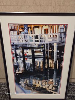 framed photorealism print by artist Alex Nizovsky depicts a marina scene titled "Sausalito Ferry