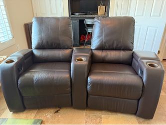 2 leather theater chairs with consoles & charging station