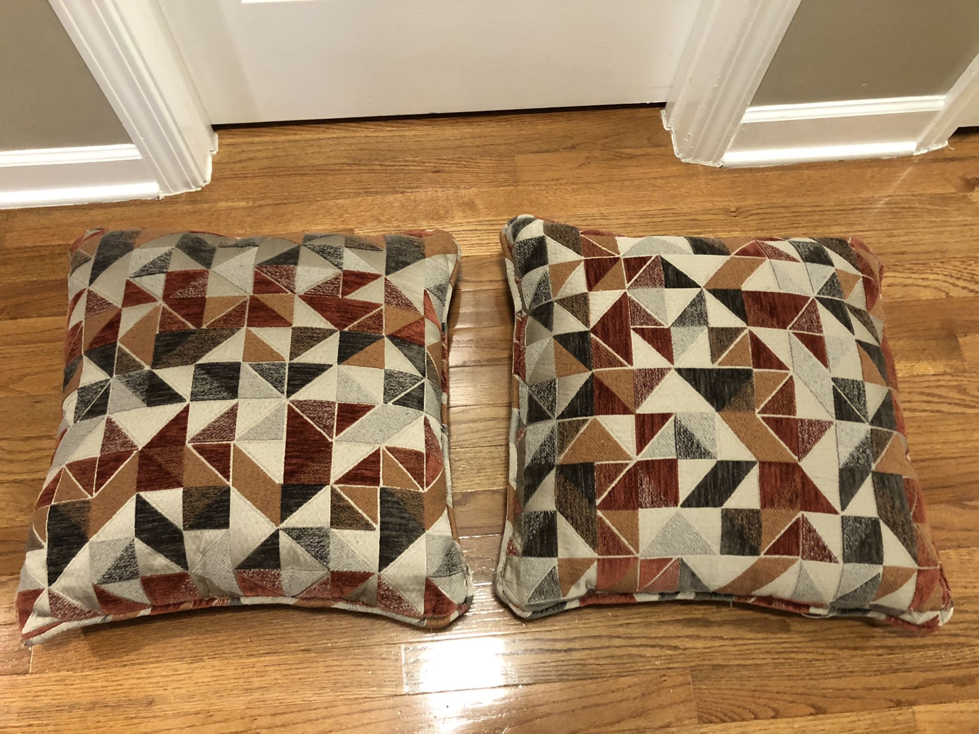Set of 2 Couch Throw Decorative Pillows in red, orange, tan and brown tones in fair condition , $5 for both. Pickup in Apex