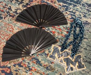 Ladies large black fans  $3. Big chain and “M” $7