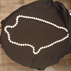 Neckless it's really a long neckless real pearls  they were my grand mothers   925 stamp says some thing else but I can't read what it says but if you