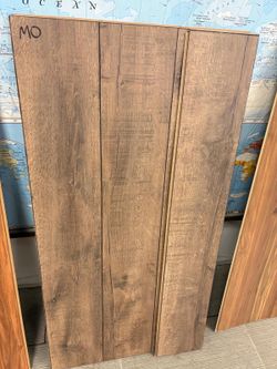 $0.75/sqft - Mud Oak Laminate Flooring
