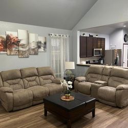 Reclining sofas with a table and two beds